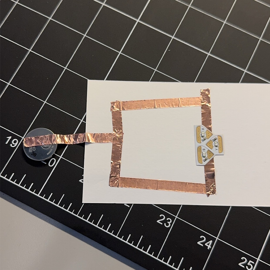 This is my first failed attempt at making the copper circuit. The batter was not connected properly and neither were the lights. 