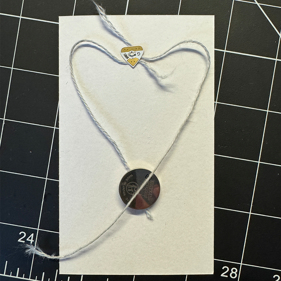 This was my attempt at executing the idea. I unfortunately could not get the conductive yarn to work in my circuit either. 