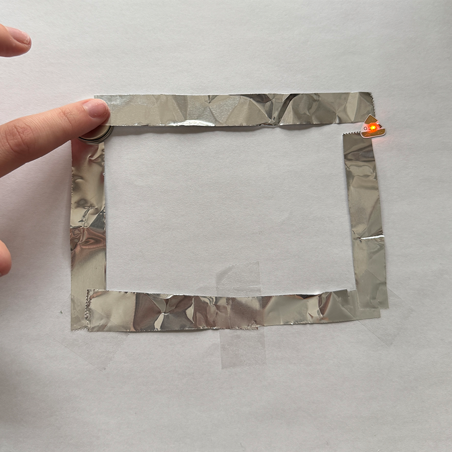 This is the circuit I created following the diagram I made. The aluminum foil worked very well.