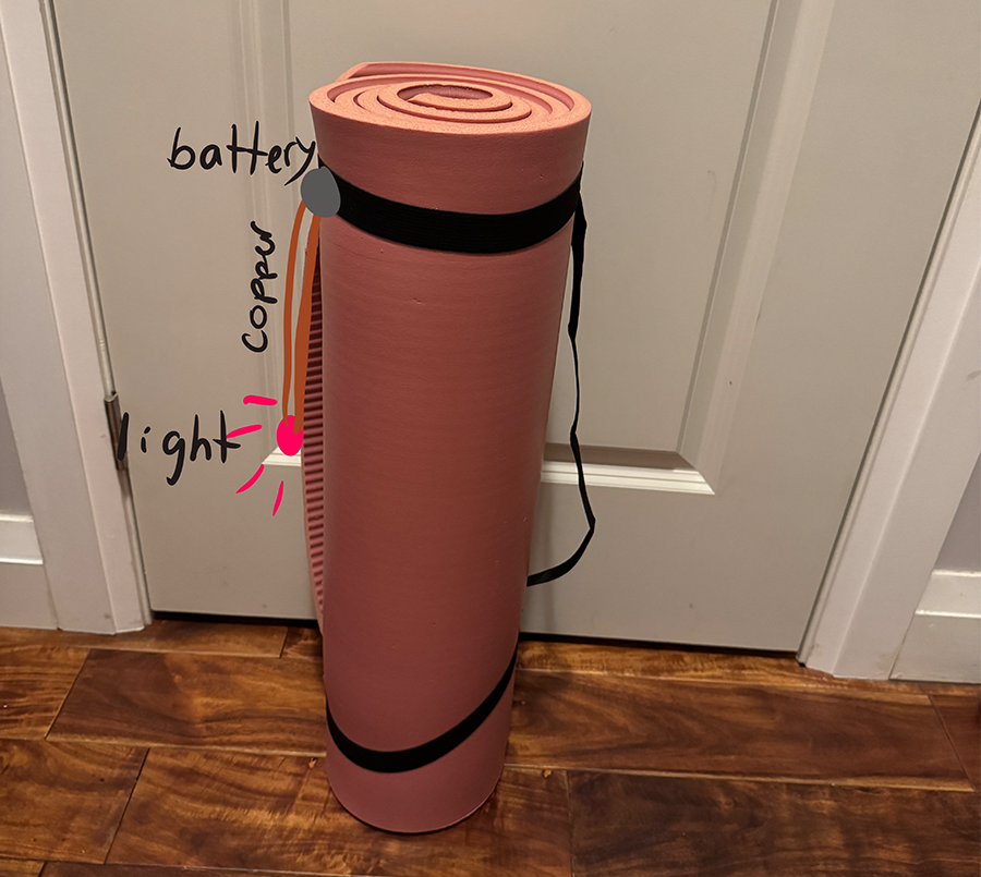 The light on the yoga mat is there in case the power goes out while at the gym and you need to see. 